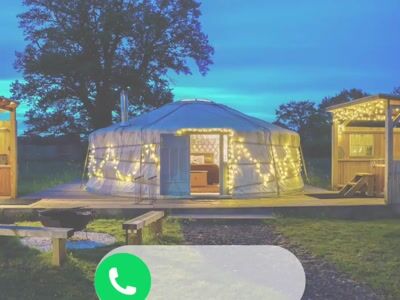 Illuminated yurt at dusk
